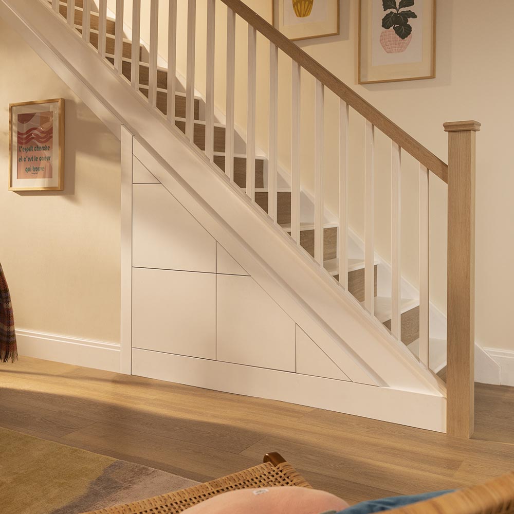 White understairs storage with the drawers pulled out